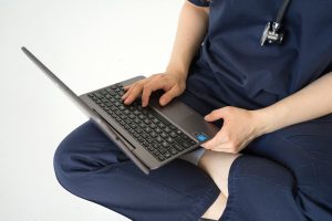 Doctor Typing at Computer