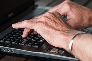 Hands Typing on Computer